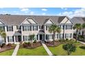 Charming townhome complex featuring manicured lawns, lush landscaping, and inviting walkways at 636 Pistoia Ln. # 636, Myrtle Beach, SC 29579