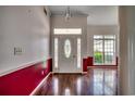 Inviting entryway with hardwood floors, wainscotting, and a decorative glass front door at 638 Hatteras River Rd., Myrtle Beach, SC 29588
