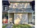 Exterior view of townhome featuring a covered entry way, lawn, and neutral siding at 755 Burcale Rd. # G4, Myrtle Beach, SC 29579