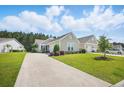 Charming home with a well-manicured lawn, attractive landscaping, and inviting curb appeal at 779 Salerno Circle # A, Myrtle Beach, SC 29579