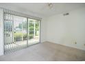 Bright bedroom with sliding doors and neutral carpet, offering a serene retreat at 8925 Duckview Dr. # A, Surfside Beach, SC 29575