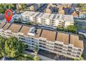 Bird's-eye view of a multi-story condo building with swimming pools and well-maintained landscaping at 9581 Shore Dr. # 127, Myrtle Beach, SC 29572