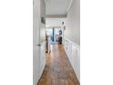 Inviting hallway featuring tile flooring, wainscoting, and an open view into the living area at 9581 Shore Dr. # 127, Myrtle Beach, SC 29572