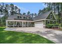 Charming home with an attached garage and a concrete driveway at 109 Obd Way, Myrtle Beach, SC 29588