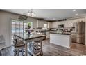 Bright eat-in kitchen featuring stainless appliances, granite countertops, and an island at 113 Adelphia Rd., Loris, SC 29569