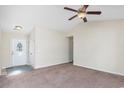Spacious living room with plush carpeting, ceiling fan, and a welcoming atmosphere at 1217 Cymmer Ct., Conway, SC 29527