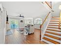 Open-concept living area with a staircase and seamless access to outdoor spaces at 131 Sago Palm Dr., Myrtle Beach, SC 29579