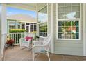Cozy front porch featuring comfortable wicker seating, great for relaxing and enjoying the outdoors at 1631 Murrell Pl., Murrells Inlet, SC 29576