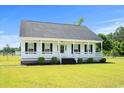 Classic single-story home with a covered front porch, perfect for enjoying the outdoors at 1763 Lipscomb Rd., Mullins, SC 29574