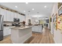 Spacious kitchen featuring stainless steel appliances, granite countertops, and a breakfast bar at 2000-D Willow Run Dr. # D, Little River, SC 29566