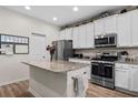 Well-equipped kitchen featuring granite counters, stainless steel appliances, and ample cabinet space at 2000-D Willow Run Dr. # D, Little River, SC 29566