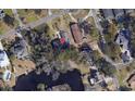 Aerial view of the property's location in a quiet residential neighborhood near a pond at 2010 Ye Olde Kings Hwy., North Myrtle Beach, SC 29582