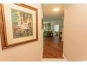 Inviting hallway leading to a cozy living room with wood floors and artwork at 2241 Waterview Dr. # 315, North Myrtle Beach, SC 29582