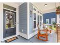 Cozy front porch with rocking chairs, perfect for enjoying the outdoors and neighborhood views at 2492 Goldfinch Dr., Myrtle Beach, SC 29577