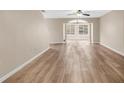 Open-concept living room featuring new laminate flooring, neutral paint, and abundant natural light at 2546 Whetstone Ln., Myrtle Beach, SC 29579