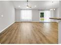 Bright, spacious living room with stylish hard flooring, ceiling fan and natural light with easy access to outdoors at 255 Yauhanna Lake Dr., Georgetown, SC 29440