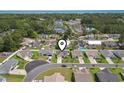 Aerial view showcasing the home's location in a quiet neighborhood near mature trees at 309 Rycola Circle, Surfside Beach, SC 29575