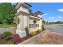 Entrance to the North Village community, featuring a decorative stone sign with colorful landscaping at 348 Hidden Cove Dr., Little River, SC 29566