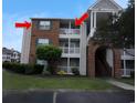 Condominium complex with tan siding, brick accents, and private balconies at 3761 Citation Way # 531, Myrtle Beach, SC 29577