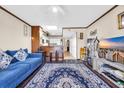 Bright living room with a ceiling fan, hardwood floors, a stylish area rug, and neutral paint at 4350 Intercoastal Dr. # 2402, Little River, SC 29566