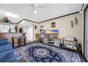Living room featuring hardwood floors, a stylish area rug, neutral paint, and access to the kitchen at 4350 Intercoastal Dr. # 2402, Little River, SC 29566