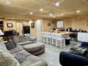 Open-concept living area with a central island, comfortable seating, and modern appliances at 445 W Willow Pond Rd., Johnsonville, SC 29555