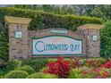 Clearwater Bay community sign surrounded by beautiful landscaping and flowers at 6244 Catalina Dr. # 511, North Myrtle Beach, SC 29582