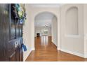 Inviting entryway with hardwood floors leads to a living area with a fireplace and lots of light at 644 Harbor Bay Dr., Murrells Inlet, SC 29576