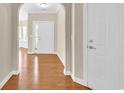 Bright foyer with hardwood flooring, neutral walls, and an arched entrance to other living spaces at 644 Harbor Bay Dr., Murrells Inlet, SC 29576
