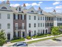 Beautiful townhomes with brick and white exteriors, landscaped lawns, and a common area at 815 Murray Ave., Myrtle Beach, SC 29577