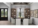 Elegant dining room with coffered ceiling, modern chandelier, and French doors, perfect for entertaining guests at 9 Sw Mashie Ct., Carolina Shores, NC 28467