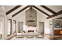Inviting living room with vaulted ceilings, exposed beams, brick fireplace and ample natural light at 9 Sw Mashie Ct., Carolina Shores, NC 28467