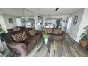 Cozy living room with comfortable seating and mirrored wall at 102 N Ocean Blvd. # 405, North Myrtle Beach, SC 29582