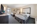 Comfortable bedroom featuring two beds, soft carpet, and a view of the ocean at 1105 S Ocean Blvd. # 928, Myrtle Beach, SC 29577