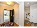 Bright foyer with hardwood floors, coat rack, and decorative trim at 1141 Prescott Circle, Myrtle Beach, SC 29577