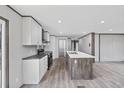Bright kitchen featuring a center island, stainless steel appliances, and a door to the back deck at 1300 Rabbit Ln., Conway, SC 29526