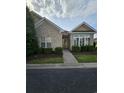 Brick home featuring tidy landscaping and a cozy, inviting entrance at 1426 Saint Thomas Circle # A 3, Myrtle Beach, SC 29577