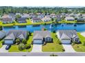 Stunning aerial view of a home on a tranquil waterfront community with mature trees at 1451 Virginia Pine Dr., Longs, SC 29568