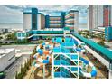 A thrilling waterpark with colorful slides, connecting bridge and the ocean as backdrop at 1501 S Ocean Blvd. # 1232, Myrtle Beach, SC 29577