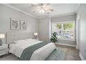 Bright bedroom with a ceiling fan, hardwood floors, and a large window with natural light at 2029 Silvercrest Dr. # 22B, Myrtle Beach, SC 29579