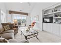 Bright living room with neutral tones, a vaulted ceiling, and a built-in entertainment center at 2241 Waterview Dr. # 532, North Myrtle Beach, SC 29582
