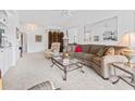 Inviting living room with plush carpeting, a stylish coffee table, and comfortable seating at 2241 Waterview Dr. # 532, North Myrtle Beach, SC 29582