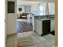 Open-concept kitchen seamlessly flows into the inviting living room with beach view at 2801 S Ocean Blvd. # 1041, North Myrtle Beach, SC 29582