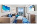 Relax in this contemporary living room with a plush sofa and ocean views at 3000 N Ocean Blvd. N # 1401, Myrtle Beach, SC 29577