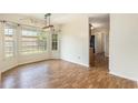 Inviting dining area filled with natural light and charming lighting fixture at 3429 Mishoe St., Loris, SC 29569