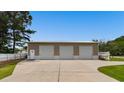 Detached metal garage with three bays and a large concrete parking pad at 3808 Mayfield Dr., Conway, SC 29526