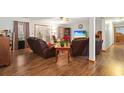 Comfortable living room features hardwood floors, ceiling fan, and leather seating at 390 Boundary Ave., Murrells Inlet, SC 29576