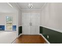 Inviting foyer with double doors, parquet floors, and views into adjacent rooms at 5206 Columbia St., Conway, SC 29526