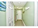 Welcoming condo entryway with a coat rack and a tile floor, setting a pleasant tone for the interior at 5905 South Kings Hwy. # 116B, Myrtle Beach, SC 29575