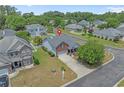 Aerial view of a home with a well-manicured lawn and a neatly arranged garden, set in a quiet neighborhood at 600 Tattlesbury Dr., Conway, SC 29526